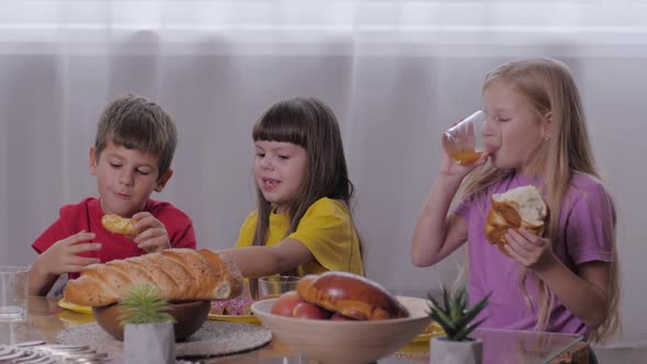 Children Eat, Cheerful Company of Friends of Kids Takes an Afternoon Snack, Bites Pastries and