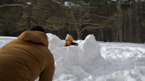 Mom, Son and Dad Are Playing Snowball Fight in Winter Forest. Family Weekend.