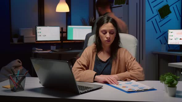 Exhausted Workaholic Businesswoman Checking Marketing Strategy in Startup Office