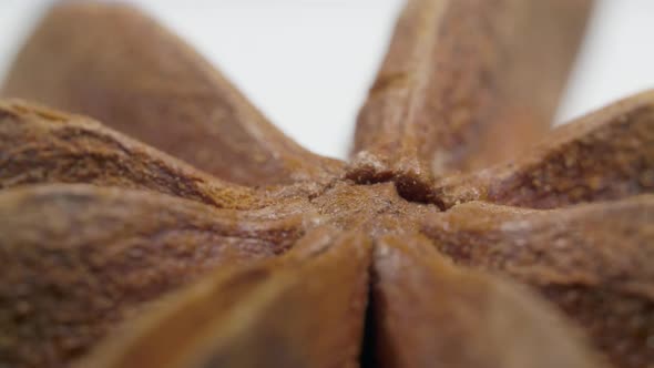 Star Anise, Spice Rotates on the Table on White Background