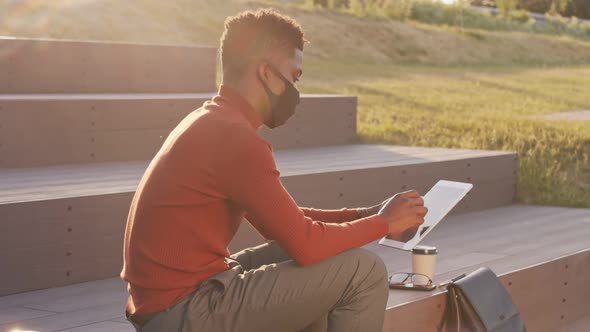 African American Businessman in Face Mask Working Outdoors