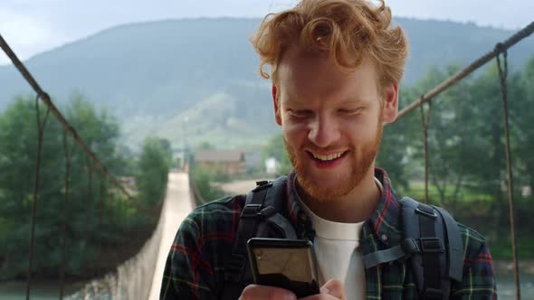 Hiker Typing Message Smartphone