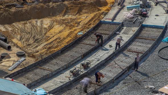 Workers with Protective Mask Welding Reinforcement for Tram Tracks in the City Timelapse