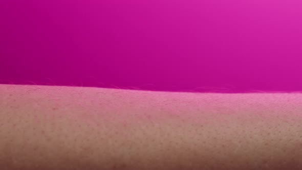 Hand Skin in Pink Neon Light Human Body Part and Ultraviolet Arm Surface Macro Shooting