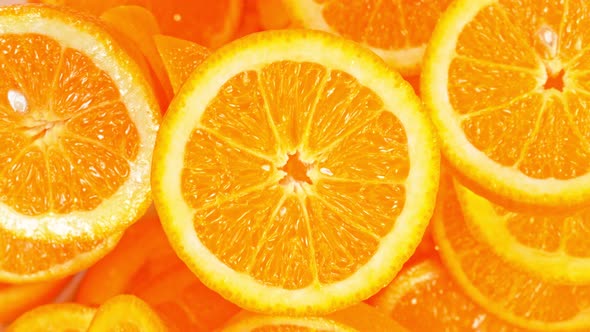 Super Slow Motion Shot of Flying Fresh Orange Slices Towards Camera at 1000 Fps