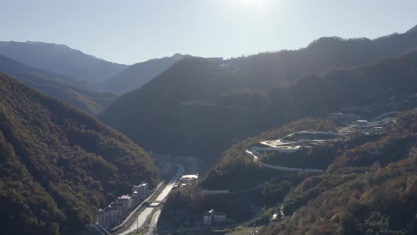 Aerial View Amazing Nature Valley Resort City Infrastructure Mountains and Sun Lights