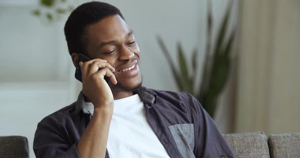 Portrait of Smiling Black Man Happy Male Face African American Guy Sitting Resting Relaxes at Home