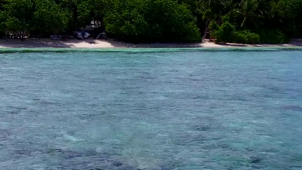 Aerial drone seascape of island beach trip by clear lagoon and sand background