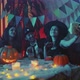 A Group of Friends are Sitting at a Table in Creepy Costumes Taking Pictures with a Camera and - VideoHive Item for Sale