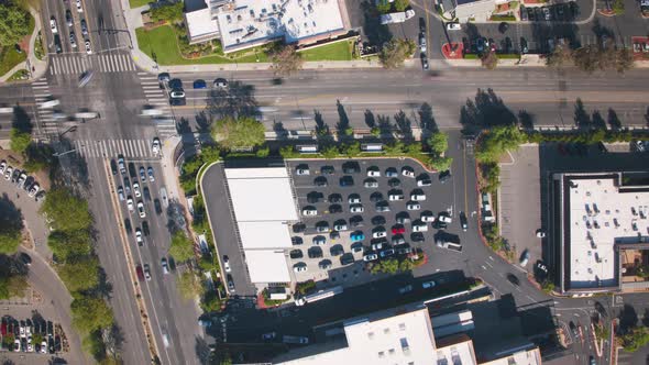 Time Lapse Aerial Fast Driving Vehicles in Line to Refuel at Gas Station in City