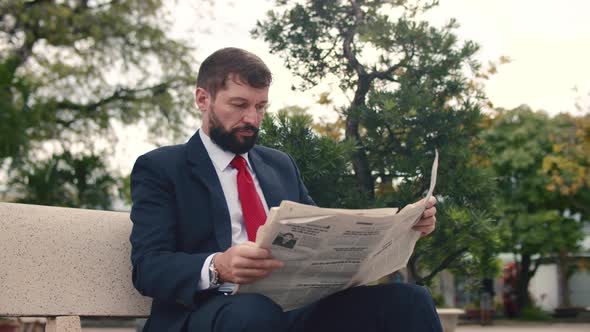 Soft Focus Footage Businessman Senior in an Expensive Suit with a Beautiful Beard in Black Blue