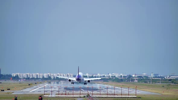 Commercial aeroplane or airliner on a final approaching landing at an International Airport on a cle