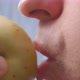 A Person Bites Off an Apple Closeup - VideoHive Item for Sale