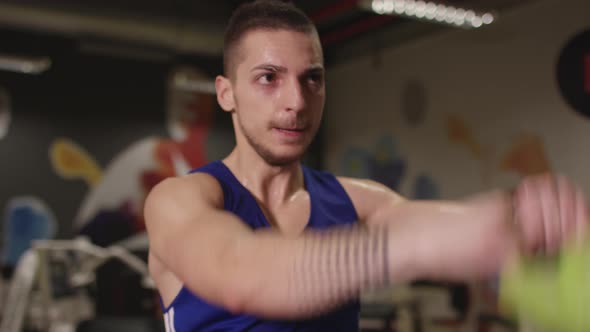 Close up of a bodybuilder training at a gym