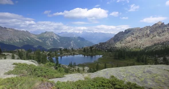 Forward Pov Walking Along Trail Discovering Clear Blue Lake