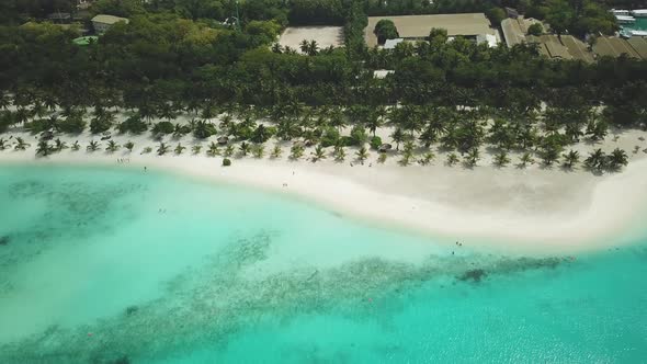 Aerial Drone View of a Beautiful Island with a Resort in the Maldives