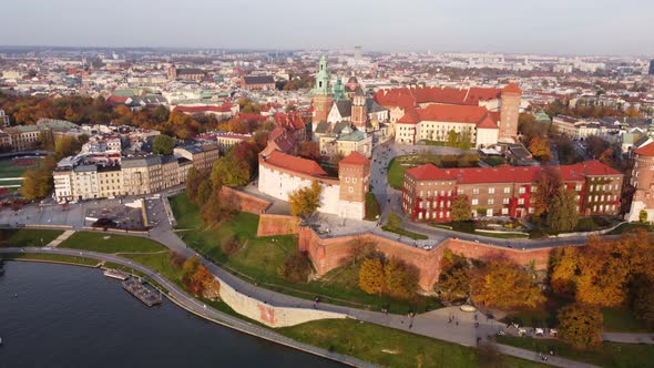 Wawel Royal Castle, autumn aerial above Vistula Krakow river, day