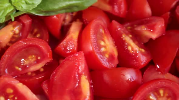 Raw sliced tomatoes and basil. Healthy vegetarian vegan organic food close up. Slider shot