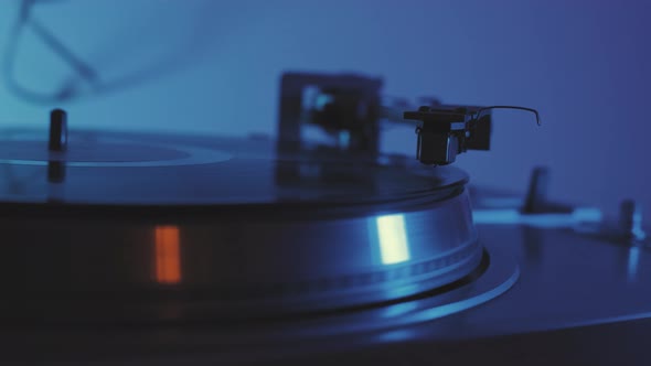 A Vinyl Record Spins in the Gramophone Music Player and Plays an Old Disco