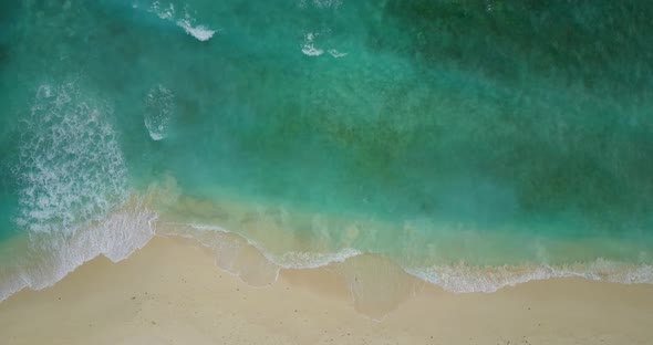 Luxury above clean view of a summer white paradise sand beach and aqua blue ocean background in hi r