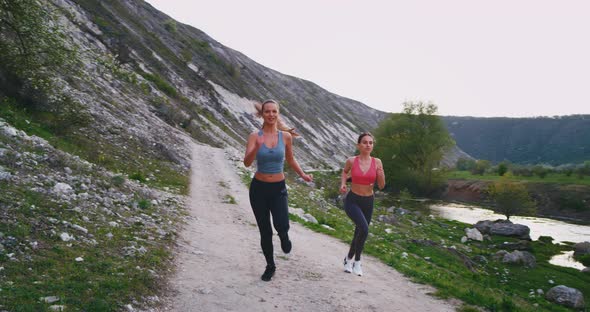 Very Beautiful Women in a Sportswear in the Middle