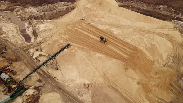 Sand Quarry in Working Process with Heavy Machinery