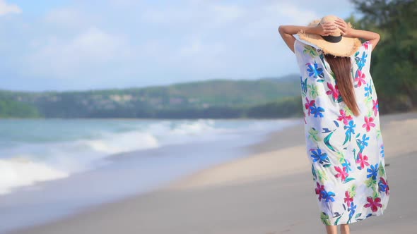 Asian woman enjoy around beautiful beach sea ocean