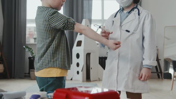 Children Playing Doctor at Home