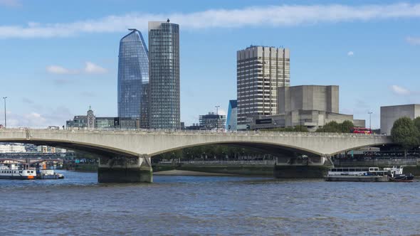 Cars Traffic on Waterloo Bridge and Container Barge on River Thames in London, England