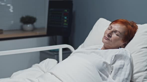 Woman Napping in Hospital Bed