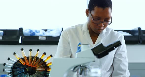 Female scientist experimenting in laboratory 4k