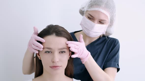 Closeup of Woman Having Facial Massage in Beauty Salon