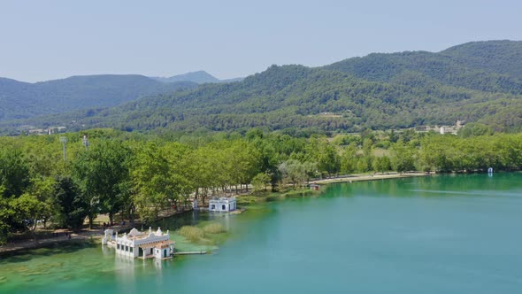 Panoramic aerial over Lake Banyoles and the surrounding Catalan countryside.