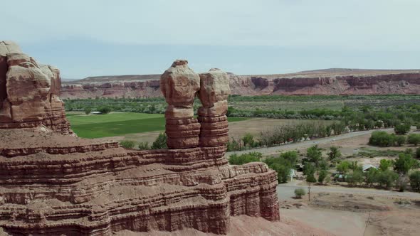 Navajo Twins Rock Formation in Southwest Desert Town of Bluff, Utah, Aerial