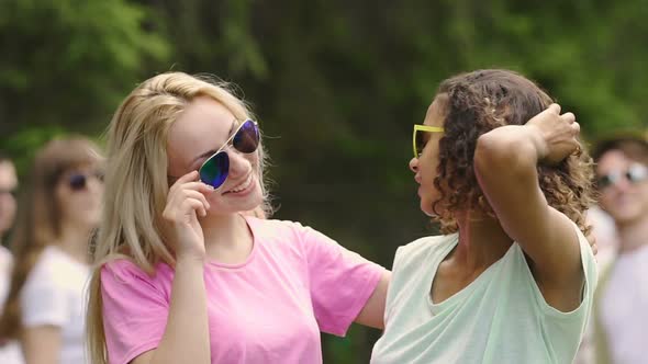 Attractive Young Women Taking Sunglasses Off While Dancing Cheerfully at Party