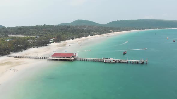 Pier with jetty. Clear turquoise water, white sand tropical beach, Koh Rong Samloem