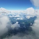 Flying through clouds over mountains - VideoHive Item for Sale