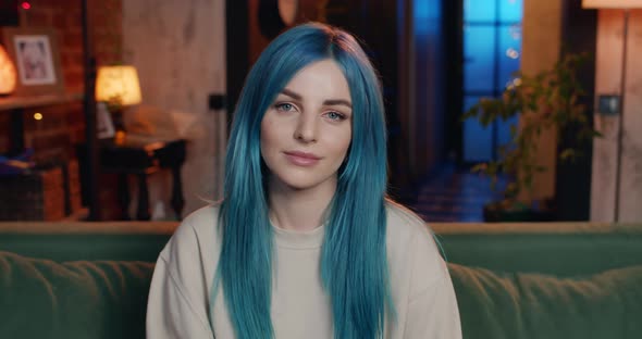 Portrait of Millennial Attractive Woman with Blue Hair Looking To Camera . Young Modern Girl Smiling