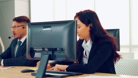 Business People Wearing Headset Working in Office