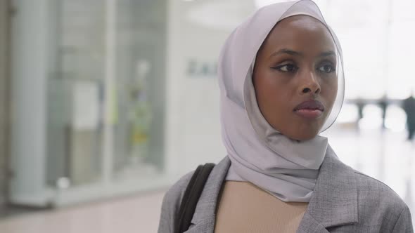Pretty Black Woman with Hijab in Modern Shopping Mall