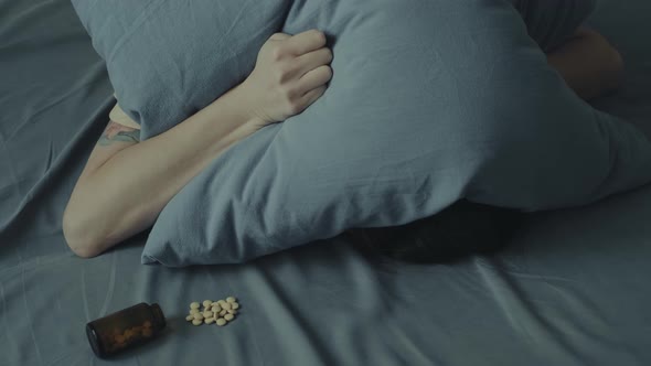 Young Unrecognizable Woman Takes Pills for Insomnia