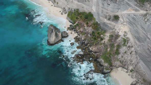 Aerial drone view of atuh beach and blue ocean waves In Nusa Penida, Bali, Indonesia