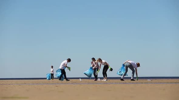 Man and Woman Volunteers with Family Recycle Plastic Bottle Child Boy Collect Plastic and