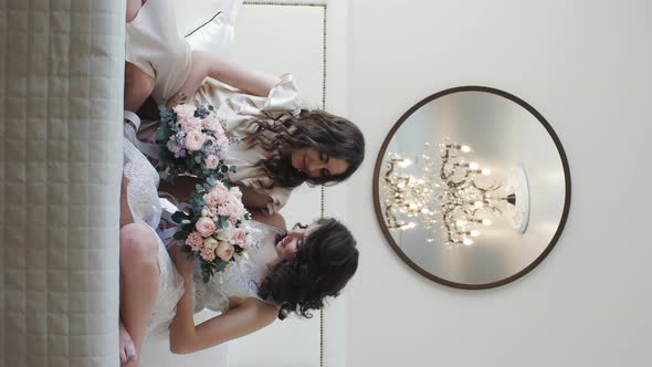 Two Girls Look at Each Other in a Hotel Room