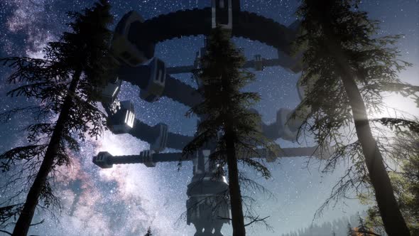 UFO Hovering Over a Forest at Night with Light Beam alt