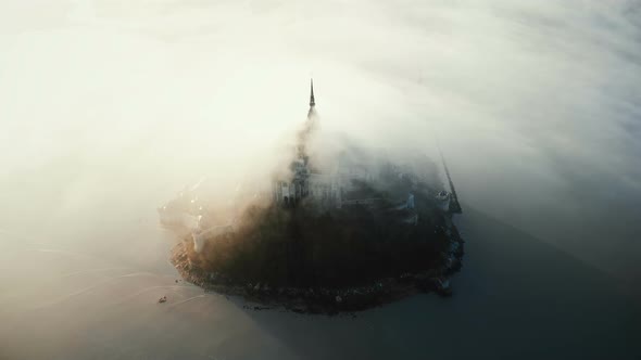 Drone Flying Around Famous Mont Saint Michel, Ancient Island Fortress Castle Hidden By Thick Foggy