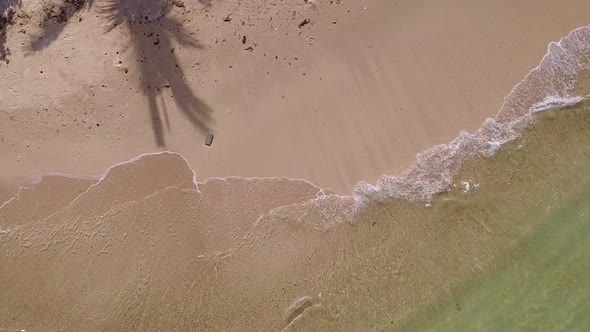 Aerial abstract of bay beach break by blue water with sand background