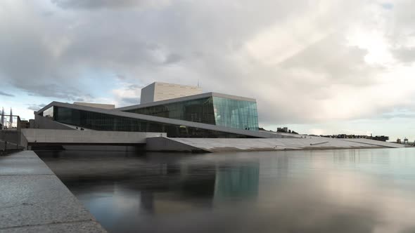 White Clouds Rolling Over The Oslo Opera House In Bjorvika, Oslo, Norway. - timelapse