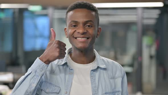 Portrait of African Man showing Thumbs Up Sign