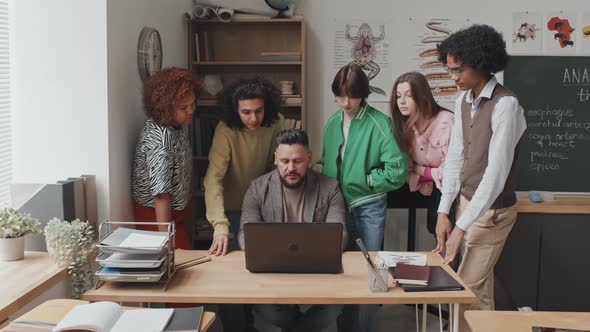 Students Talking to Teacher after Class